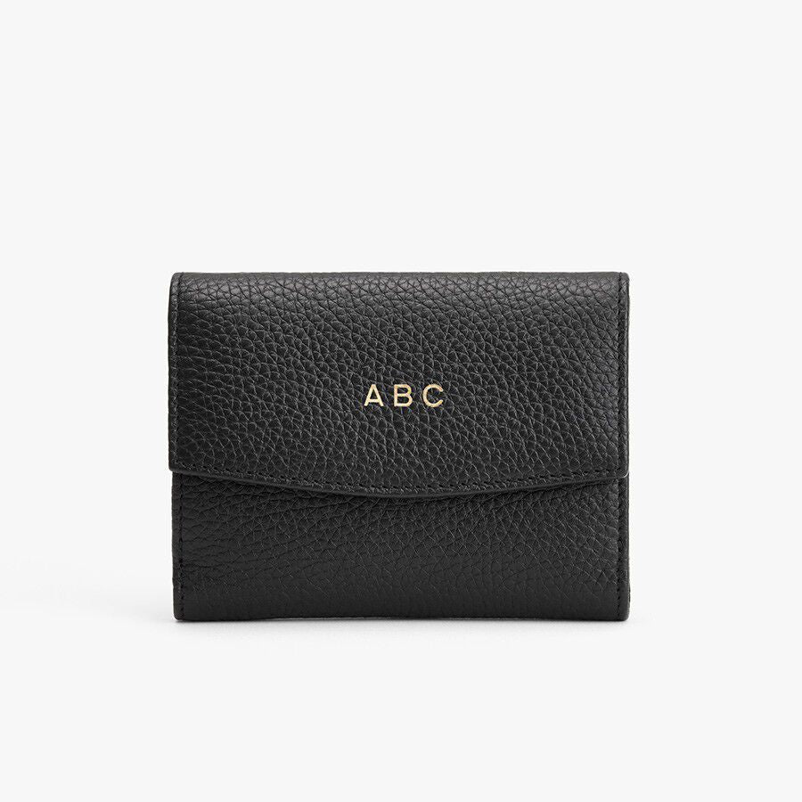 Wallet with the initials ABC on the front.