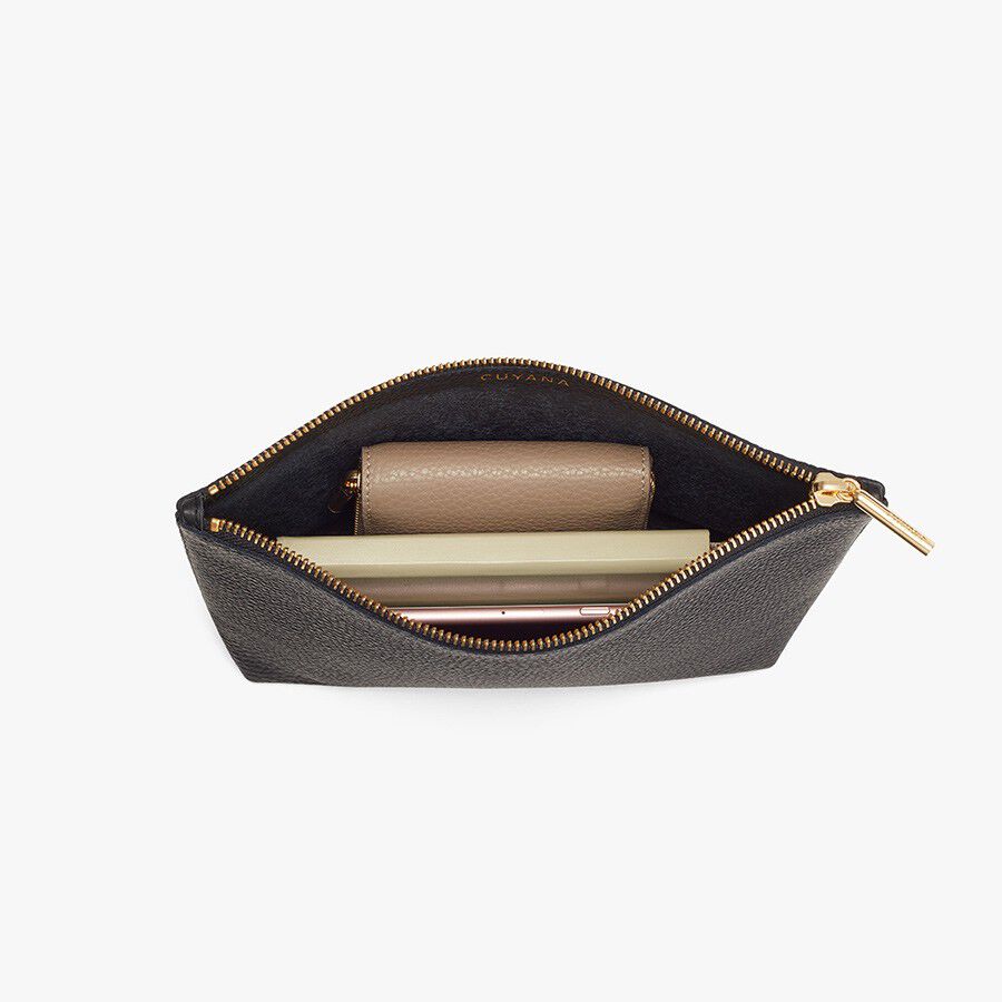 Open small pouch with a wallet and a lipstick inside.