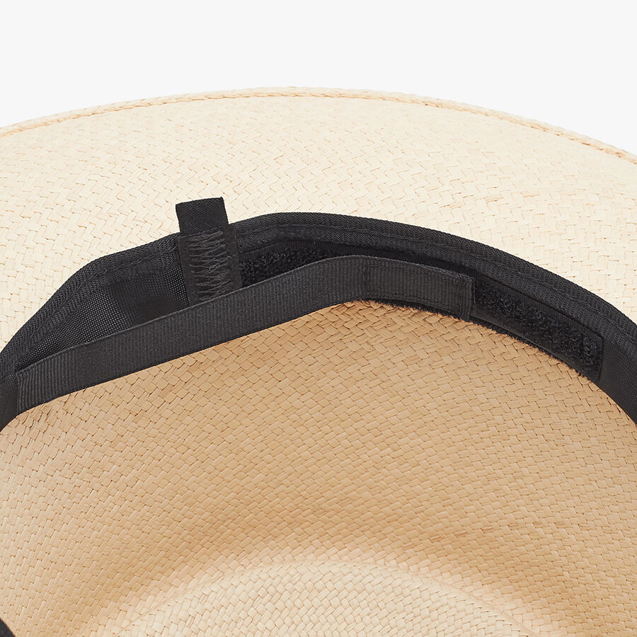 Close-up view of a hat with a ribbon band inside.