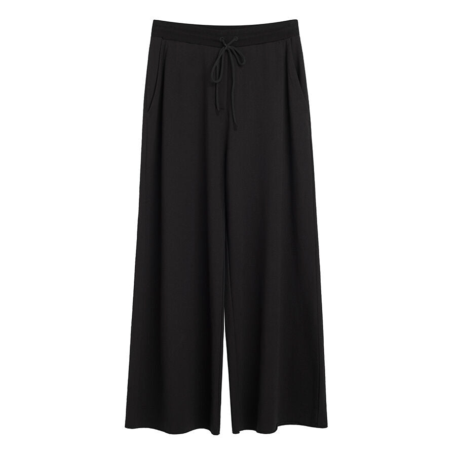 Pair of wide leg pants with drawstring waist.