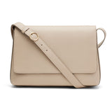 Handbag with a flap closure and an adjustable shoulder strap.