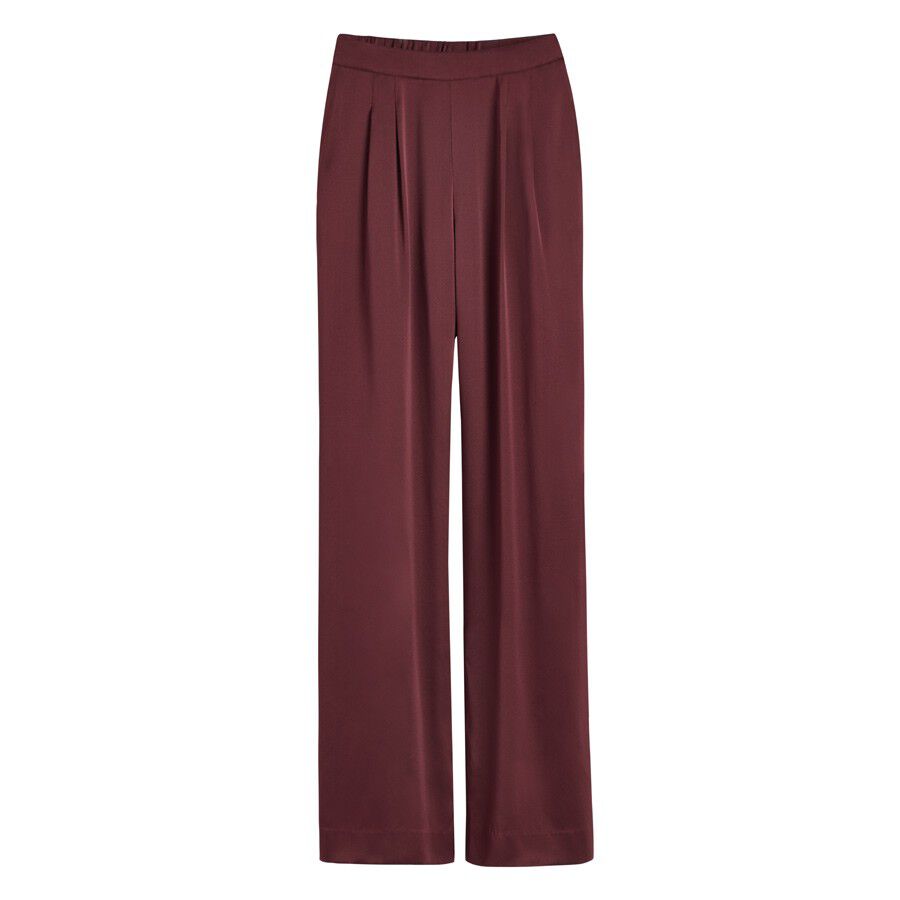 Pair of pants with a pleated front and elastic waistband.