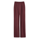 Pair of pants with a pleated front and elastic waistband.