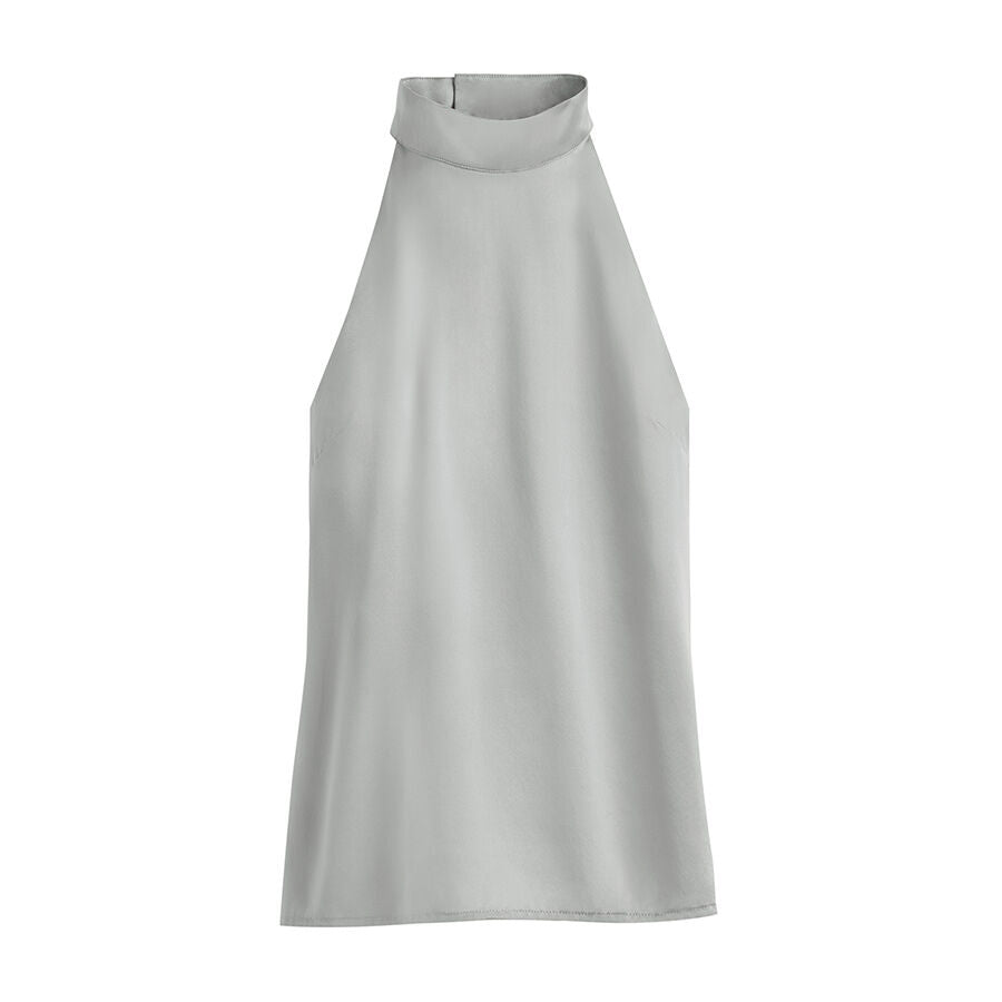 Sleeveless high-neck top on a plain background.