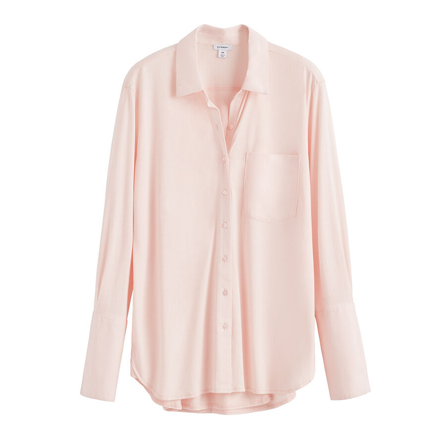 Button-up shirt with a collar and long sleeves, one pocket on the front.