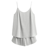 Women's sleeveless top and shorts set displayed against a plain background.