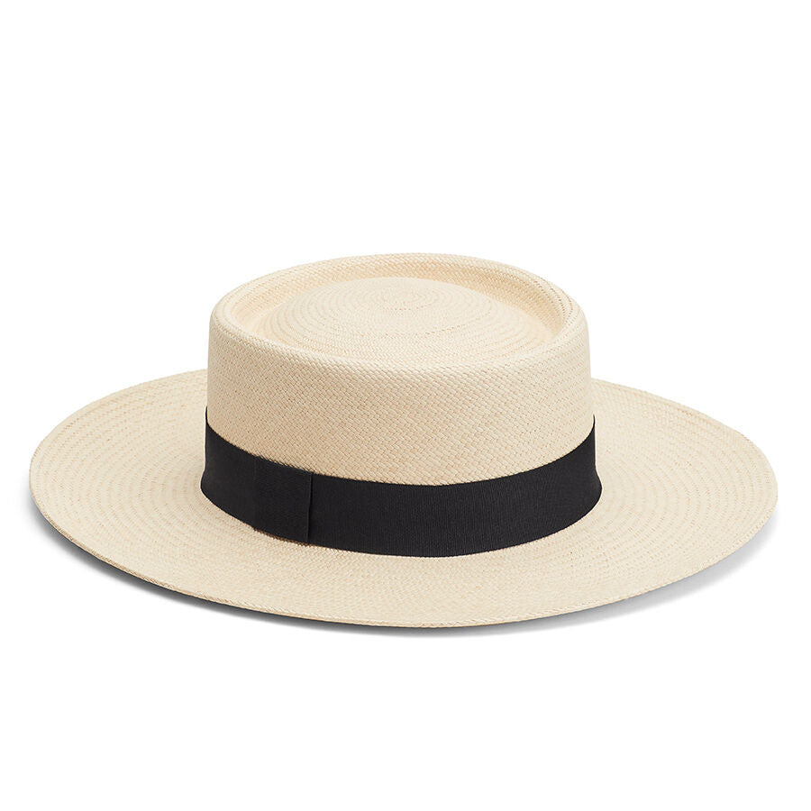 Panama hat with a black band on a white background.