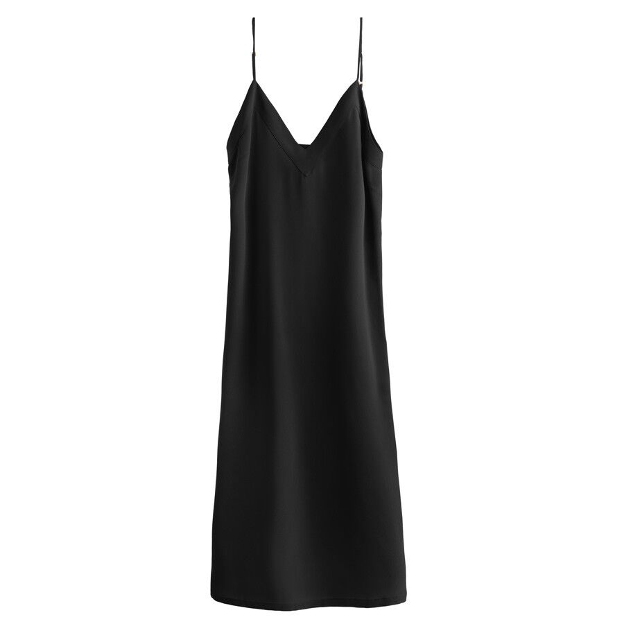 Sleeveless knee-length dress with v-neck and thin straps.