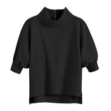 A sweatshirt with a high neck and elbow-length sleeves