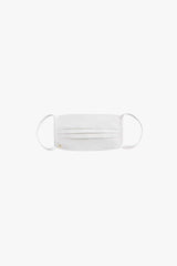 Surgical mask with elastic bands floating against a white background.