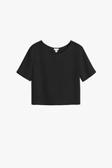Short-sleeved top isolated on a plain background.
