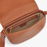 Open handbag showing interior and zipper pocket.