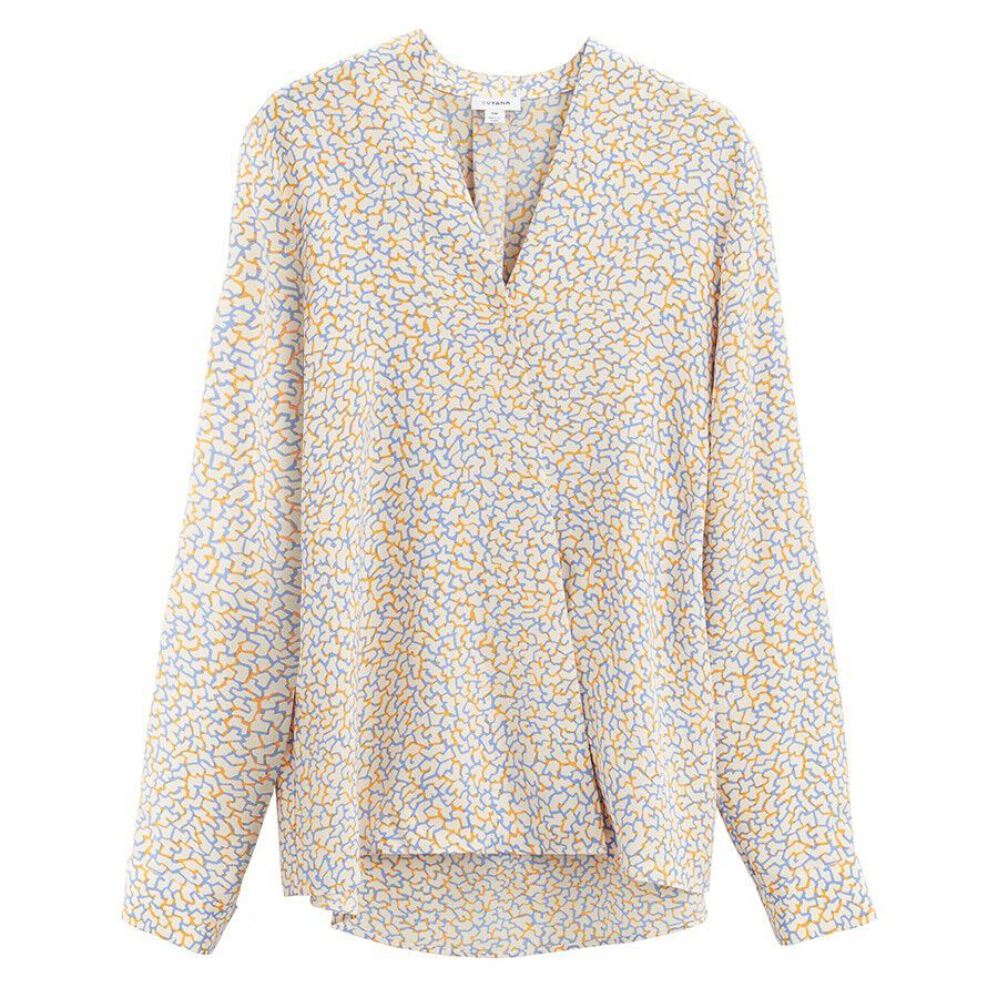 Patterned blouse with long sleeves and v-neck displayed on white background.