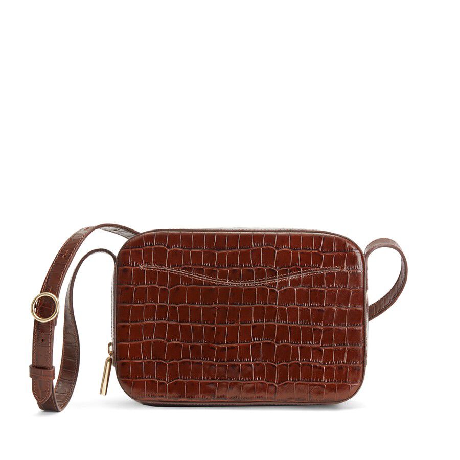Small rectangular shoulder bag with a textured pattern and a strap.