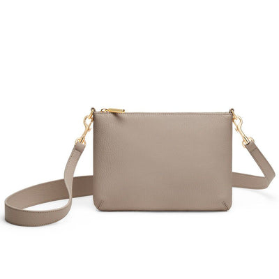 Small handbag with a long strap and zipper closure.