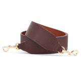 Leather strap with metal clasps at both ends
